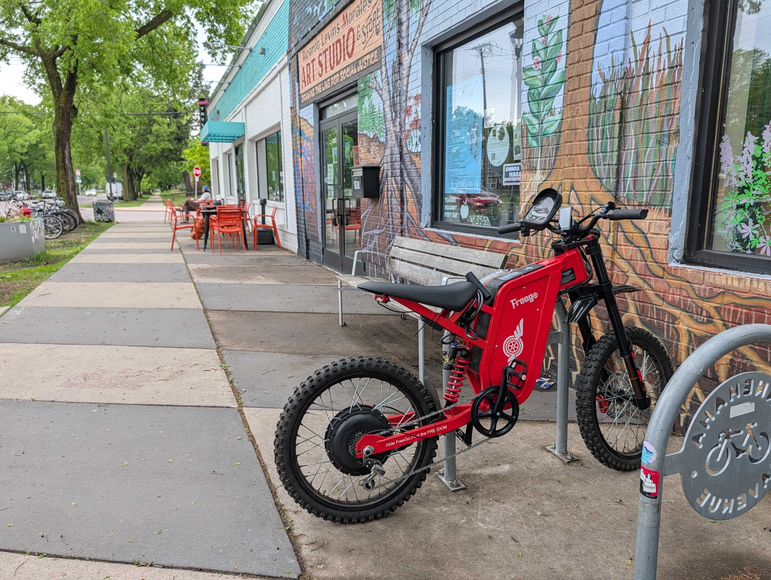 a dangerous e-moto posing as an e-bike parked in front of a local business