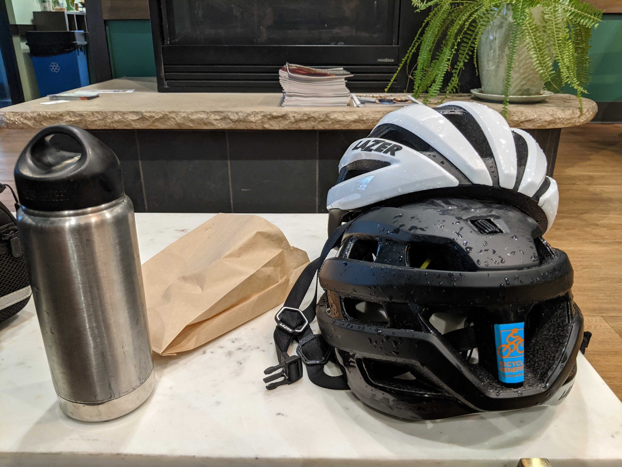 helmets on a table next to a coffee bottle