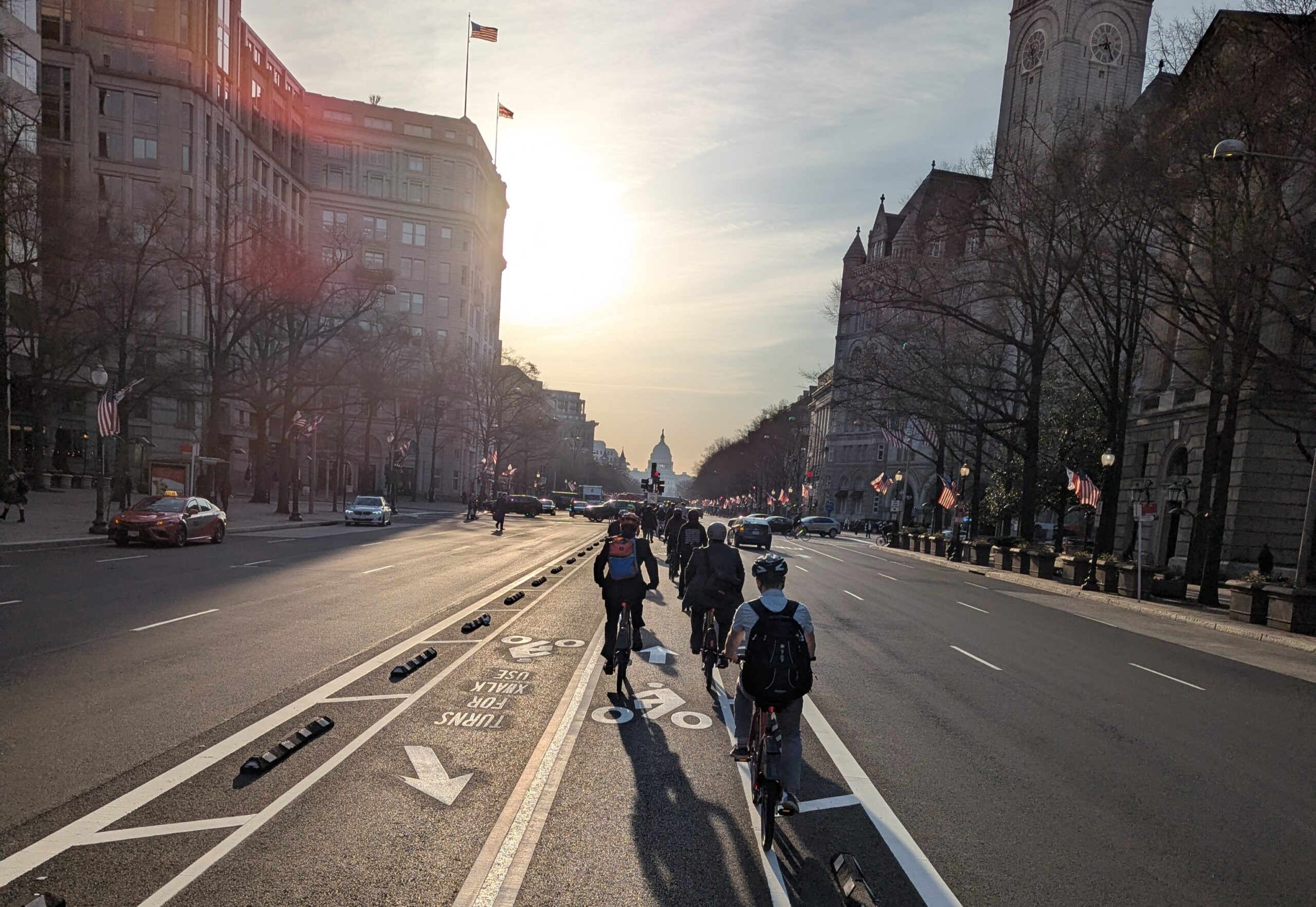 BikeMN staff and partners bike down Pennsylvania Avenue's bikeway towards the US Capitol Building